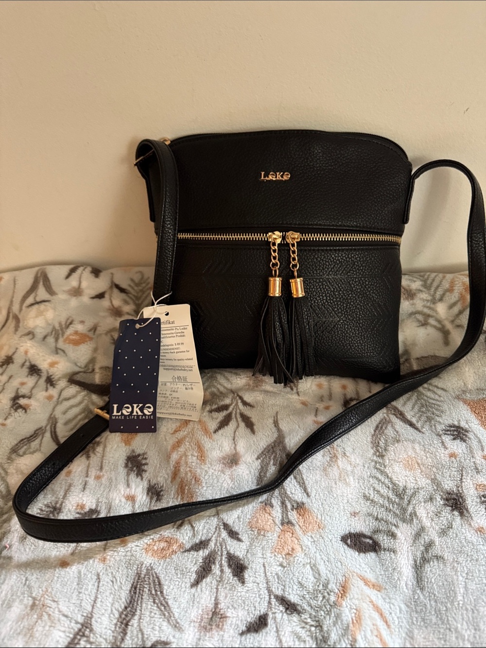 Black Crossbody Bag with Tassel Zip Accent